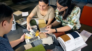 People at work, collaborating on a project design. 