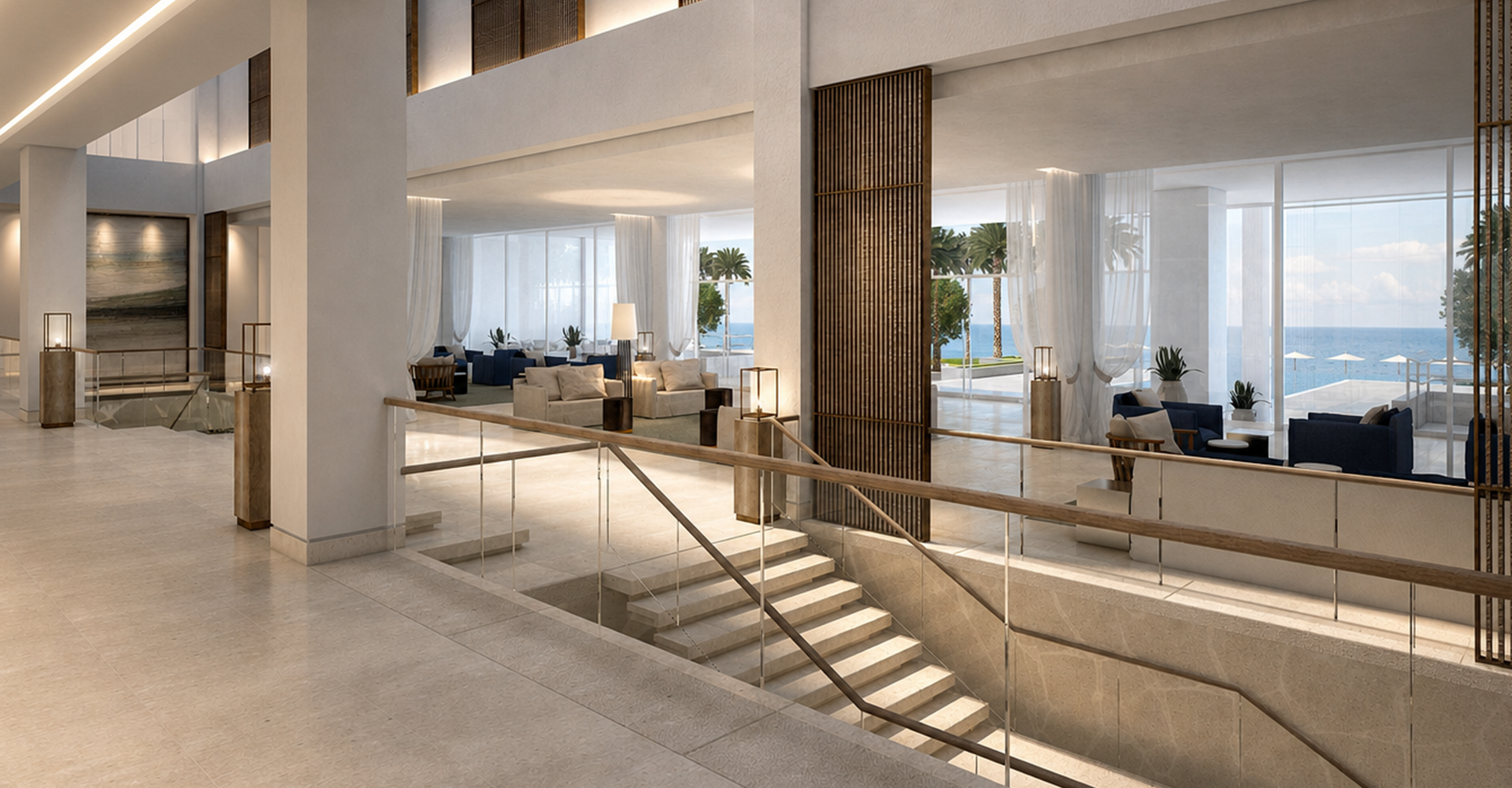 Bright modern hotel lobby interior with grand staircase, open lounge spaces, floor-to-ceiling windows, and serene ocean views in a luxury resort.